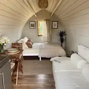 Glamping pod with a double bed and seating at Meadow View Country Park Glamping pod with a double bed and seating at Meadow View Country Park