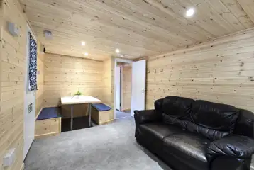 Silver Birch lodge lounge/dining area with a sofa