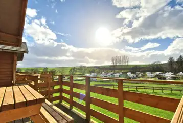 Hill View hut balcony overlooking the touring pitches