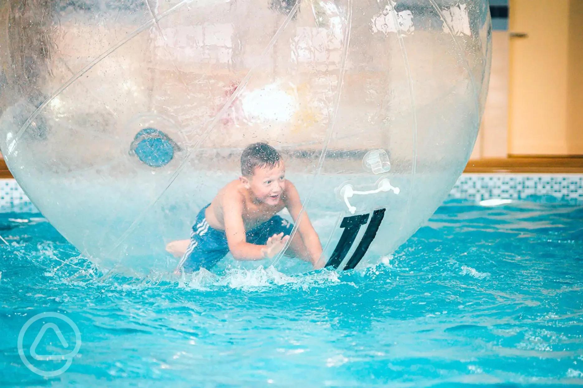 Heated indoor swimming pool with seasonal activities like Zorbing