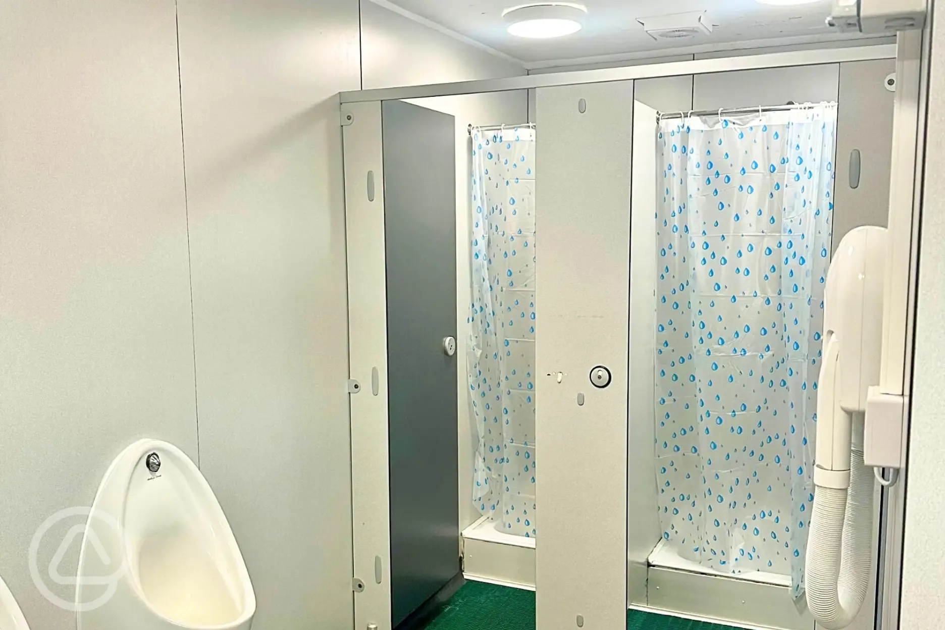 Male showers with space to change, hair dryers and urinals
