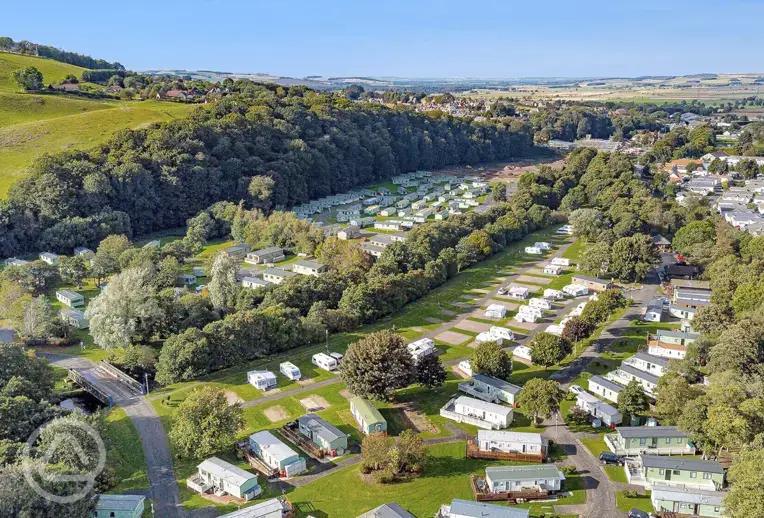 Aerial of Riverside Wooler Holiday Park with hardstanding pitches