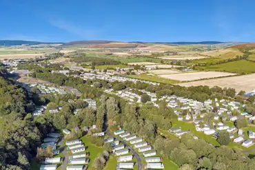 Aerial of Riverside Wooler with views towards Northumberland National Park