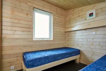 Standard beach hut twin beds (bring own bedding and towels)