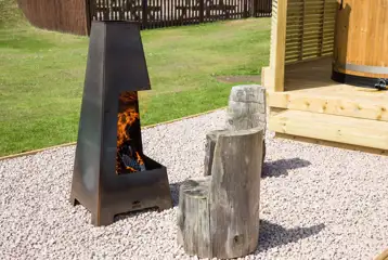 Superior pod with a fire pit area and log seats