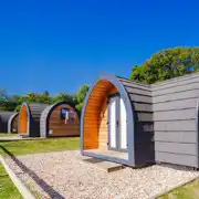 Camping pods with small gravel patio areas