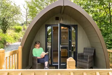 Deluxe glamping pod with a decking and outdoor seating Deluxe glamping pod with a decking and outdoor seating