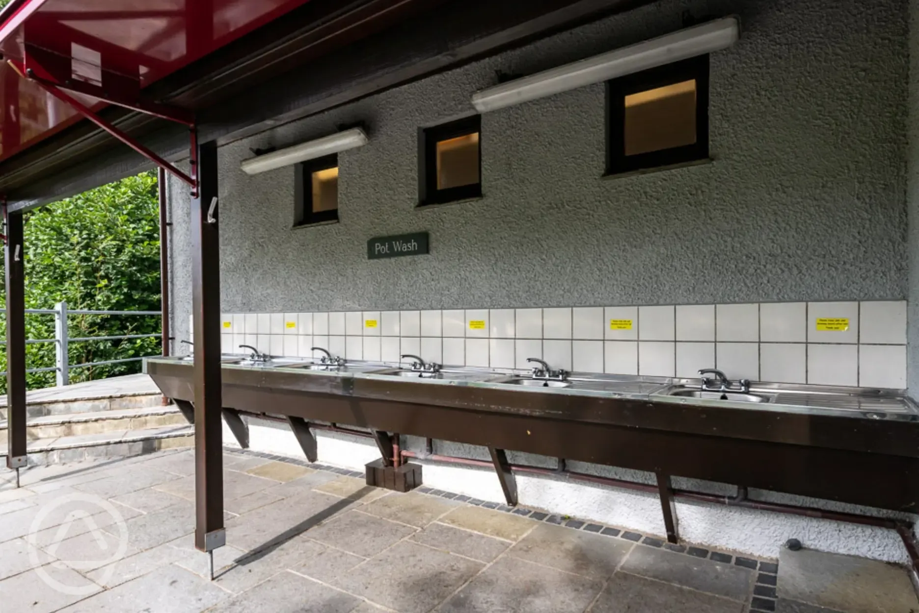 Outdoor, covered washing up area