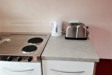 Camping pod kitchen with fridge, water carrier, electric hob, toaster and kettle Camping pod kitchen with fridge, water carrier, electric hob, toaster and kettle