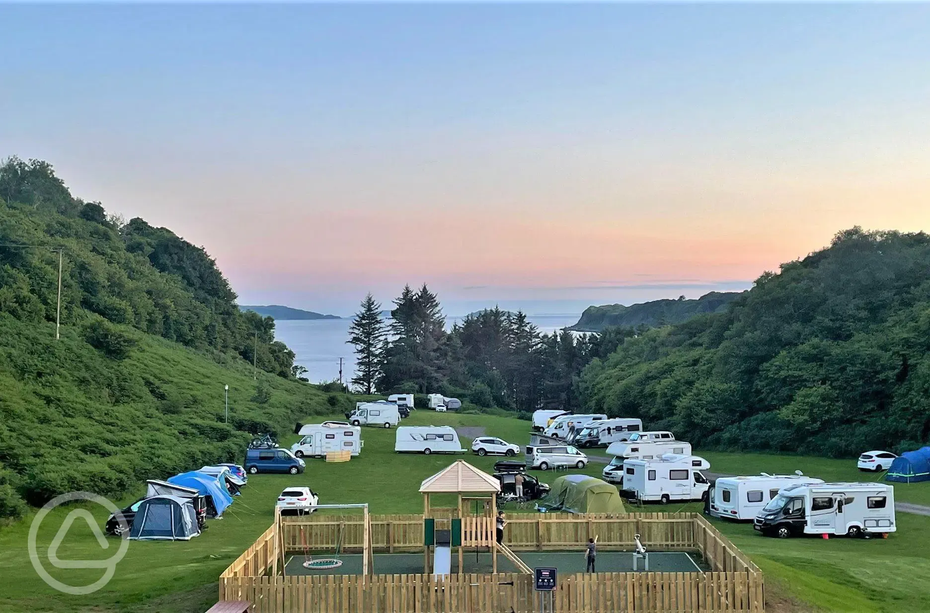 Campsite and children's playpark at sunset