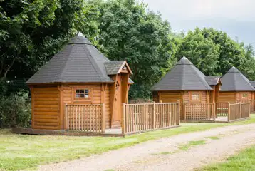 Camping cabins exterior with private decking (four persons)