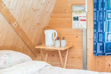 Cocoon camping pod small bedside table with a kettle