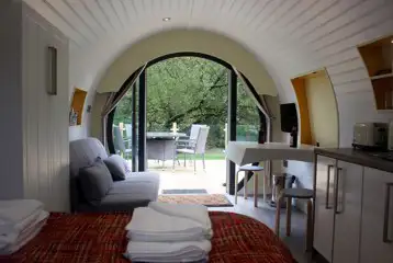 Ensuite glamping pod double sofa bed, dining area and TV Ensuite glamping pod double sofa bed, dining area and TV