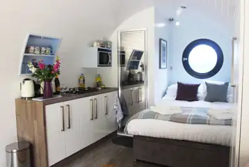 Ensuite glamping pod double bed and kitchenette Ensuite glamping pod double bed and kitchenette