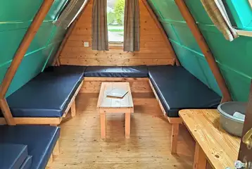 Camping pod interior with four sleeping platforms (please bring bedding)