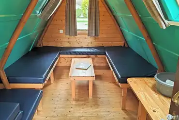 Camping pod interior with four sleeping platforms (please bring bedding)