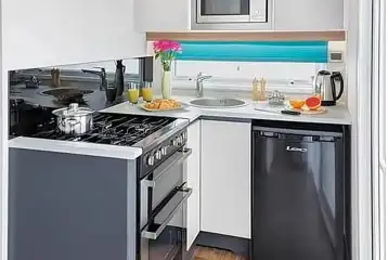 S pod (two person) kitchen area with a hob, fridge/freezer, kettle and more