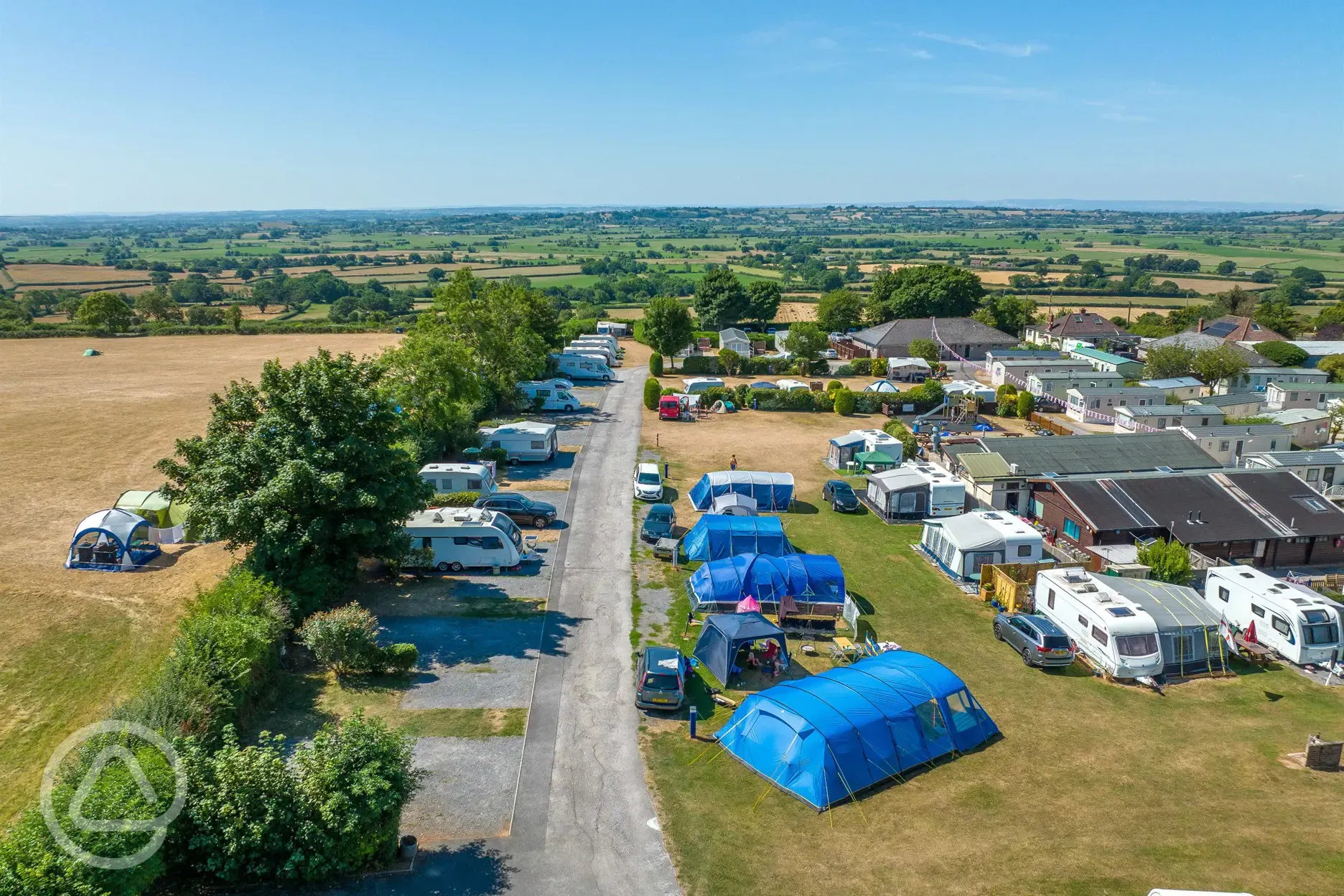 Aerial of Bucklegrove Holiday Park with grass and hardstanding pitches