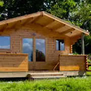 Camping cabins with an outdoor picnic table Camping cabins with an outdoor picnic table