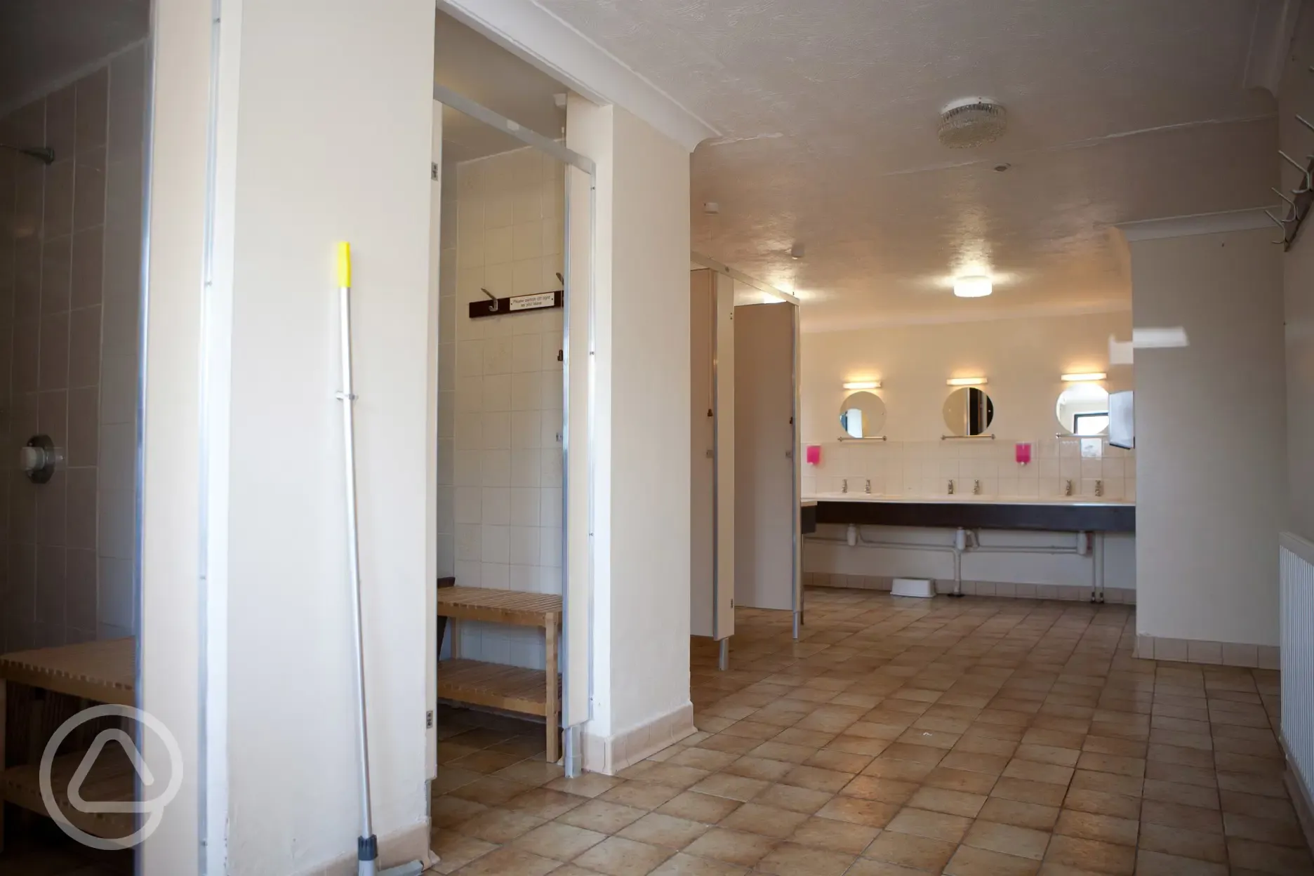 Showers with hooks and benches for clothes/getting changed