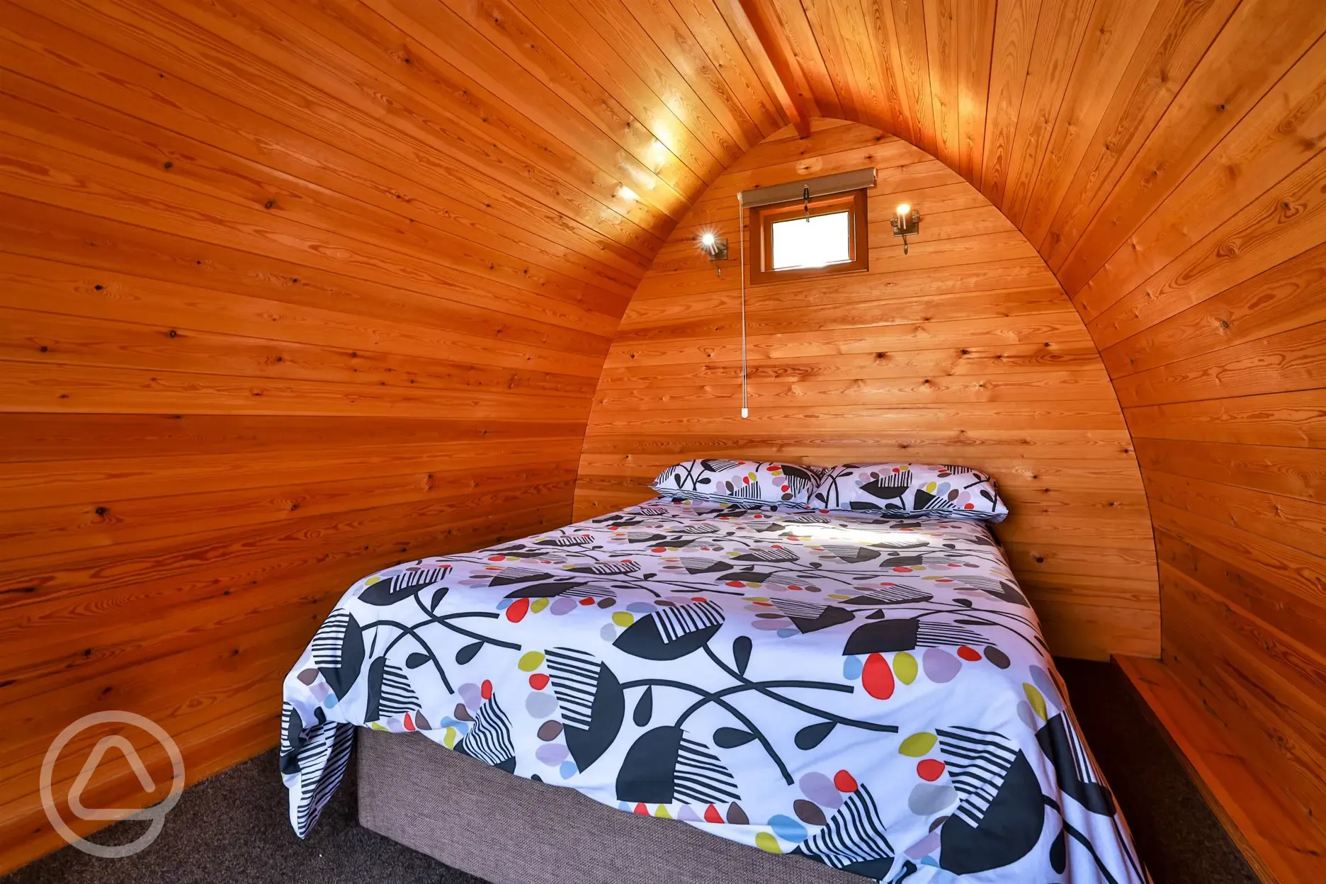 Double bed inside camping pod
