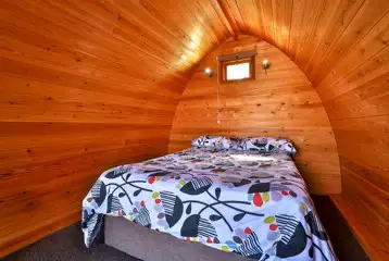 Double bed inside camping pod Double bed inside camping pod