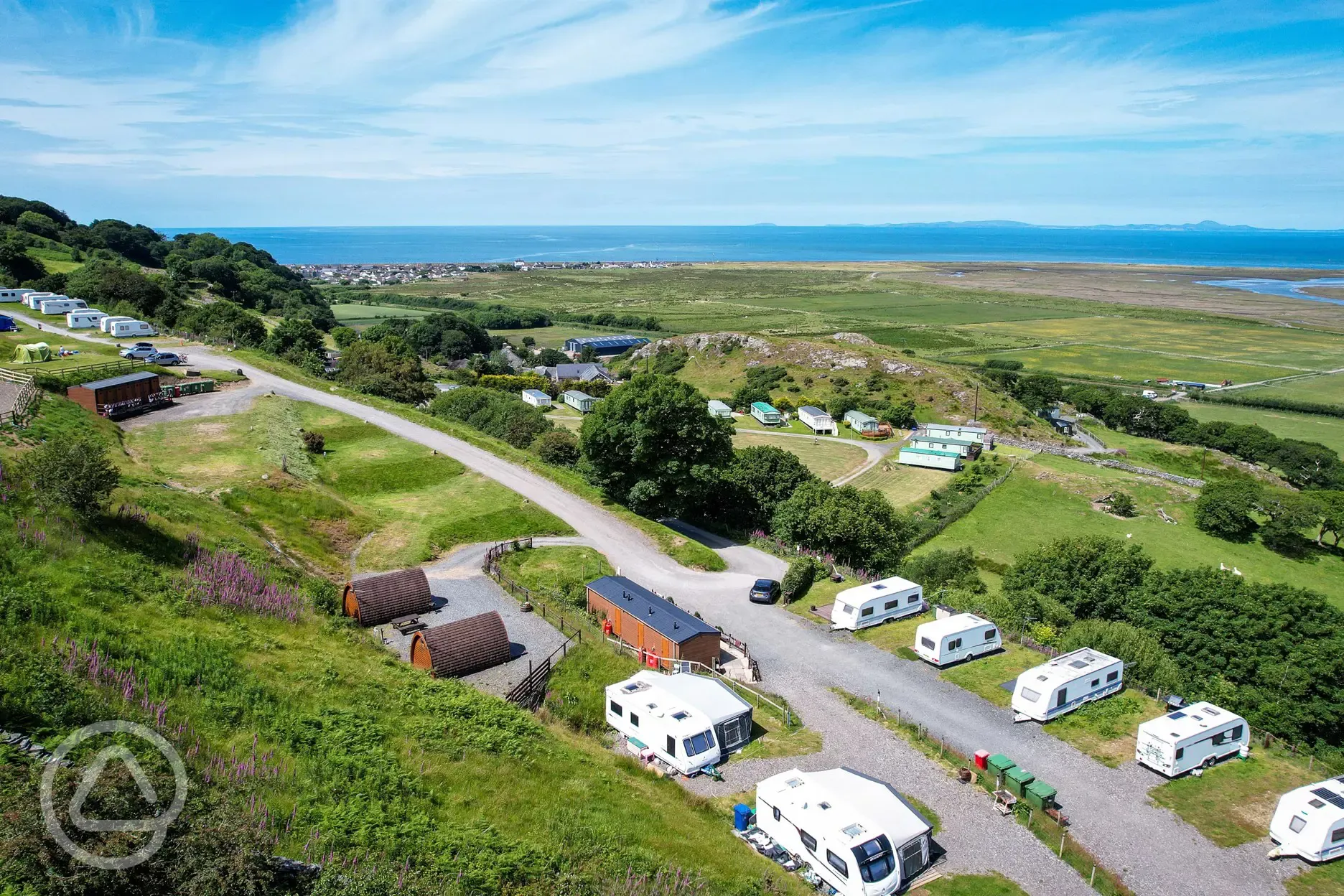 Hardstanding pitches beside Mawddach View and Mountain View camping pod
