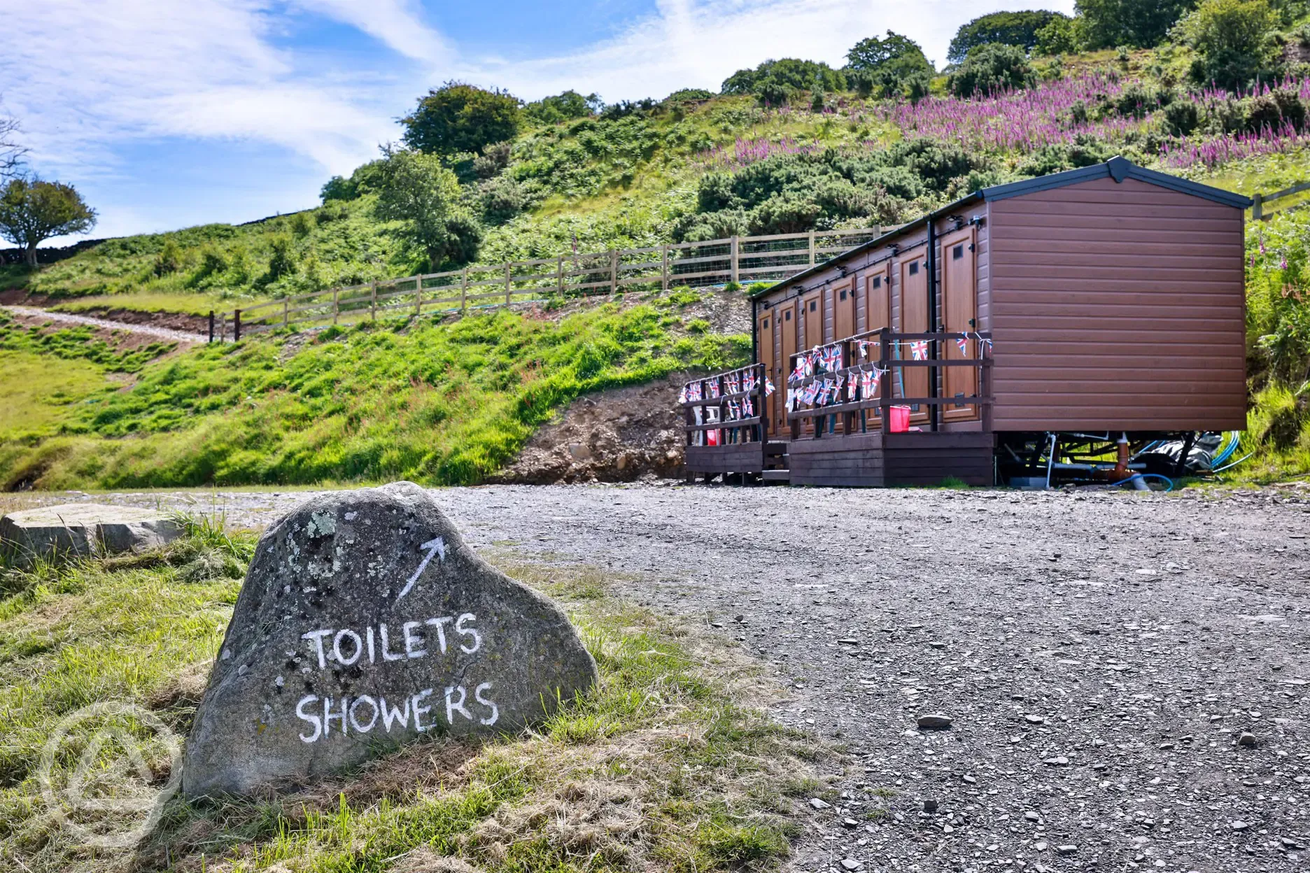 Facility block with individual toilets and free showers