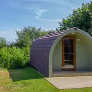 Camping pod with a small wooden deck Camping pod with a small wooden deck