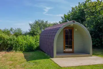 Camping pod with a small wooden deck Camping pod with a small wooden deck