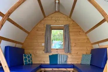 Camping pod interior with sofas