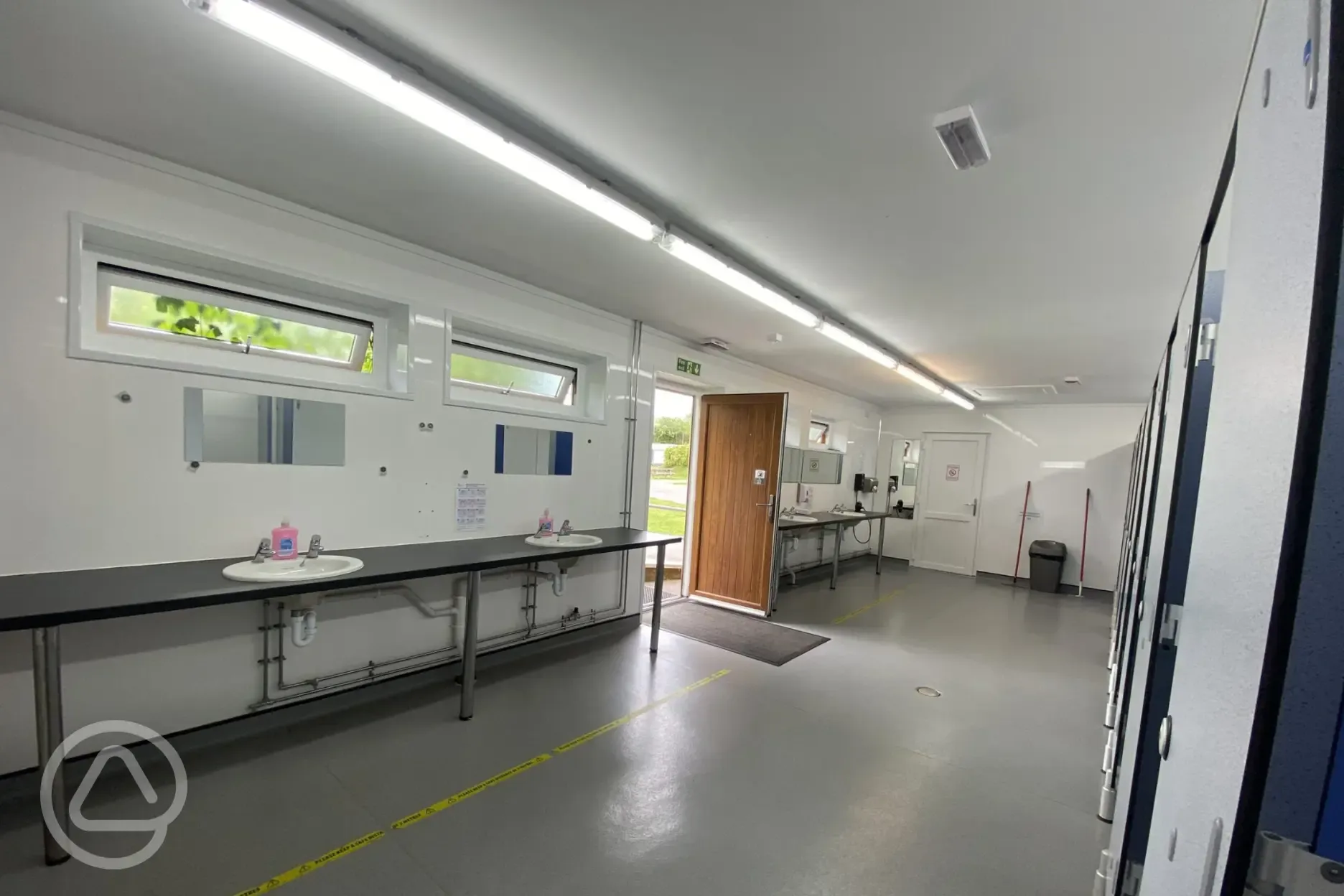 Sinks, mirrors, and hairdryers in the facility block