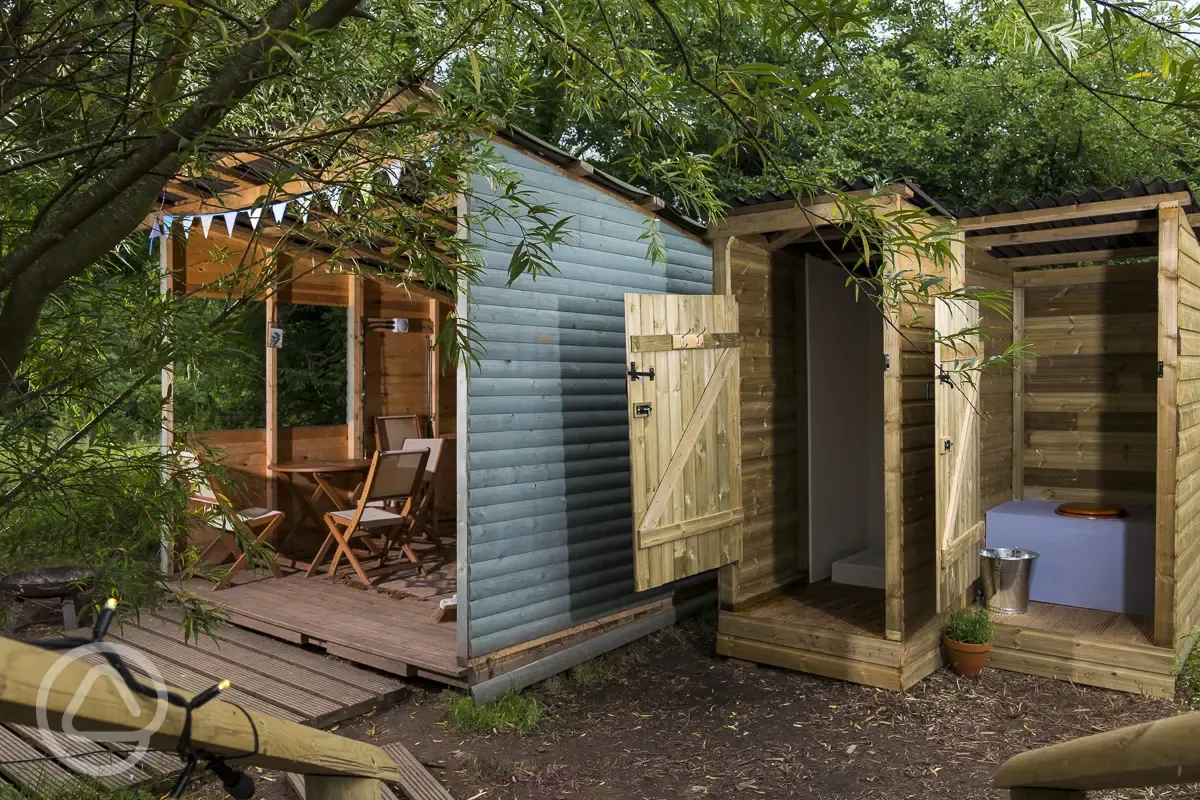 Wooden cabin outdoor sheltered kitchen and private eco loo and shower
