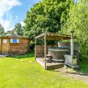 Wooden cabin with a private, sheltered wood-fired hot tub