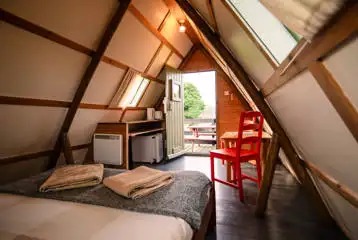 Original couple camping pod small kitchen and dining area Original couple camping pod small kitchen and dining area