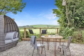 Cynefin Roundhouse with outdoor seating area and view