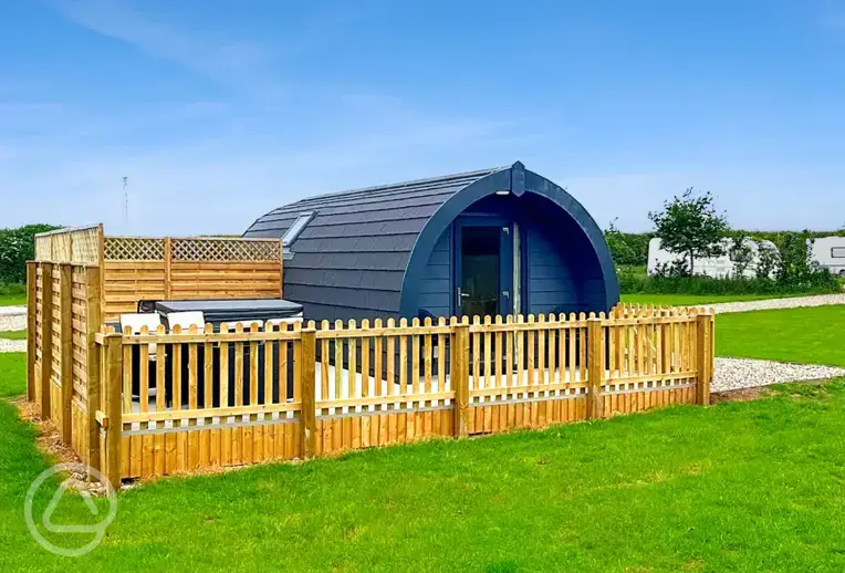 Ensuite glamping pod with a fenced-off private decked area and a hot tub