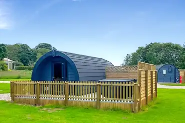 Ensuite glamping pods with fenced-off private decked areas and hot tubs