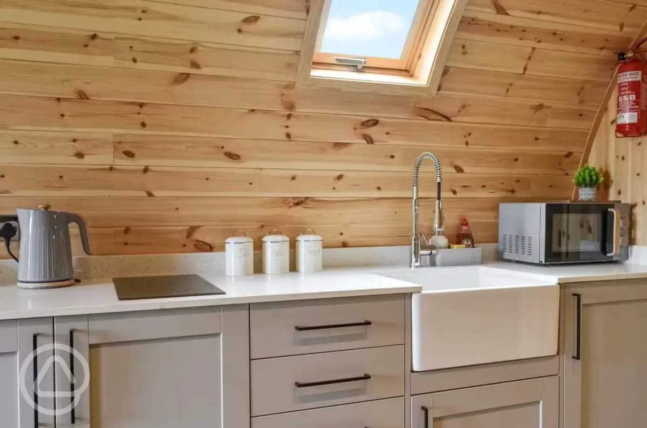 Pod kitchen with hob, kettle, toaster, microwave, air fryer, fridge and freezer