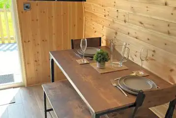 Ensuite glamping pod dining area and TV Ensuite glamping pod dining area and TV