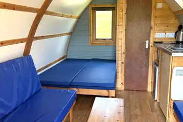 Glamping pods with a double bed, bench seating and an ensuite toilet Glamping pods with a double bed, bench seating and an ensuite toilet