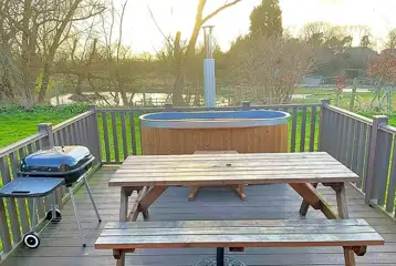 Glamping pod hot tubs, seating and BBQ Glamping pod hot tubs, seating and BBQ