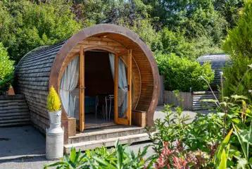 Glamping pod (adult only) with double doors opening outside Glamping pod (adult only) with double doors opening outside