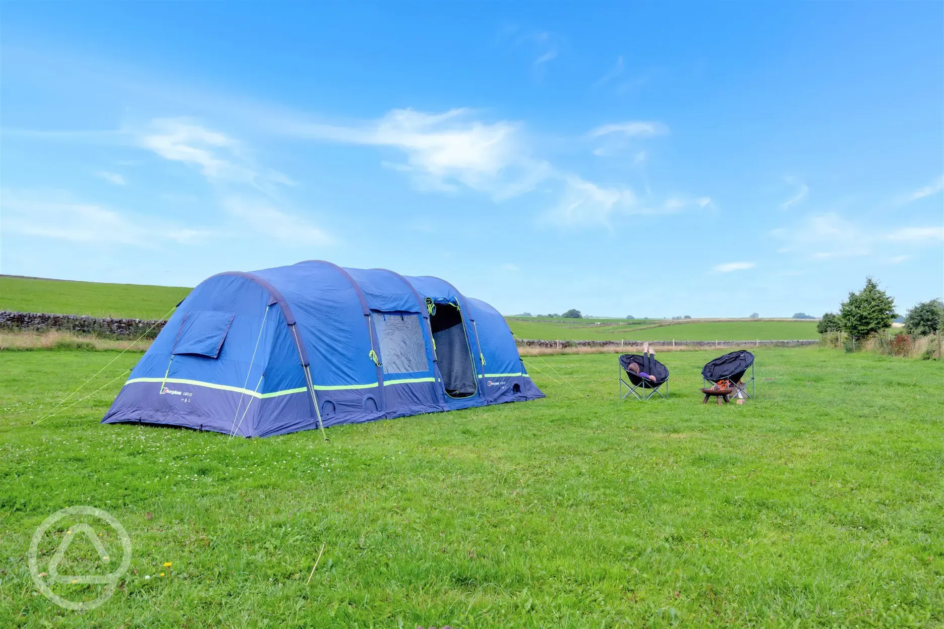Non electric grass tent pitches (adult only) surrounded by fields
