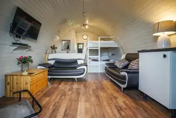 Deluxe pod interior with double bunk beds, sleeping four