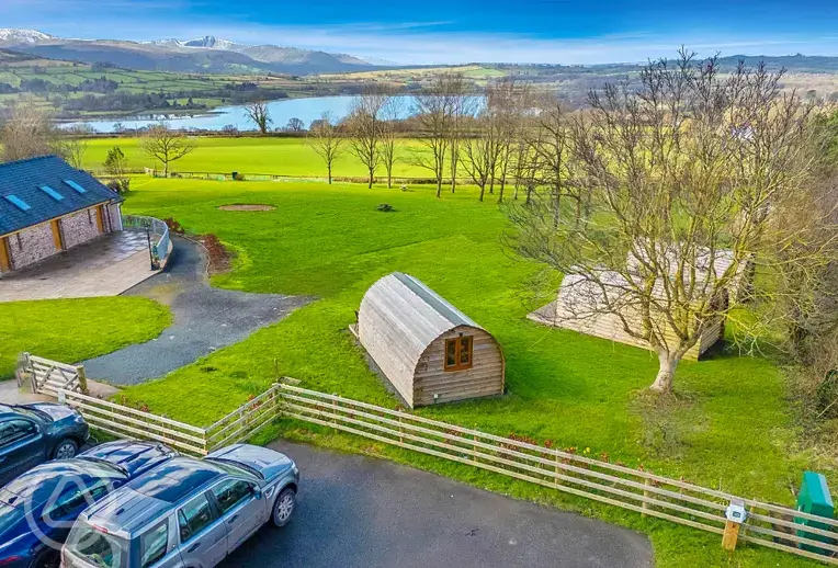 Aerial of the camping pods overlooking Llangorse Lake