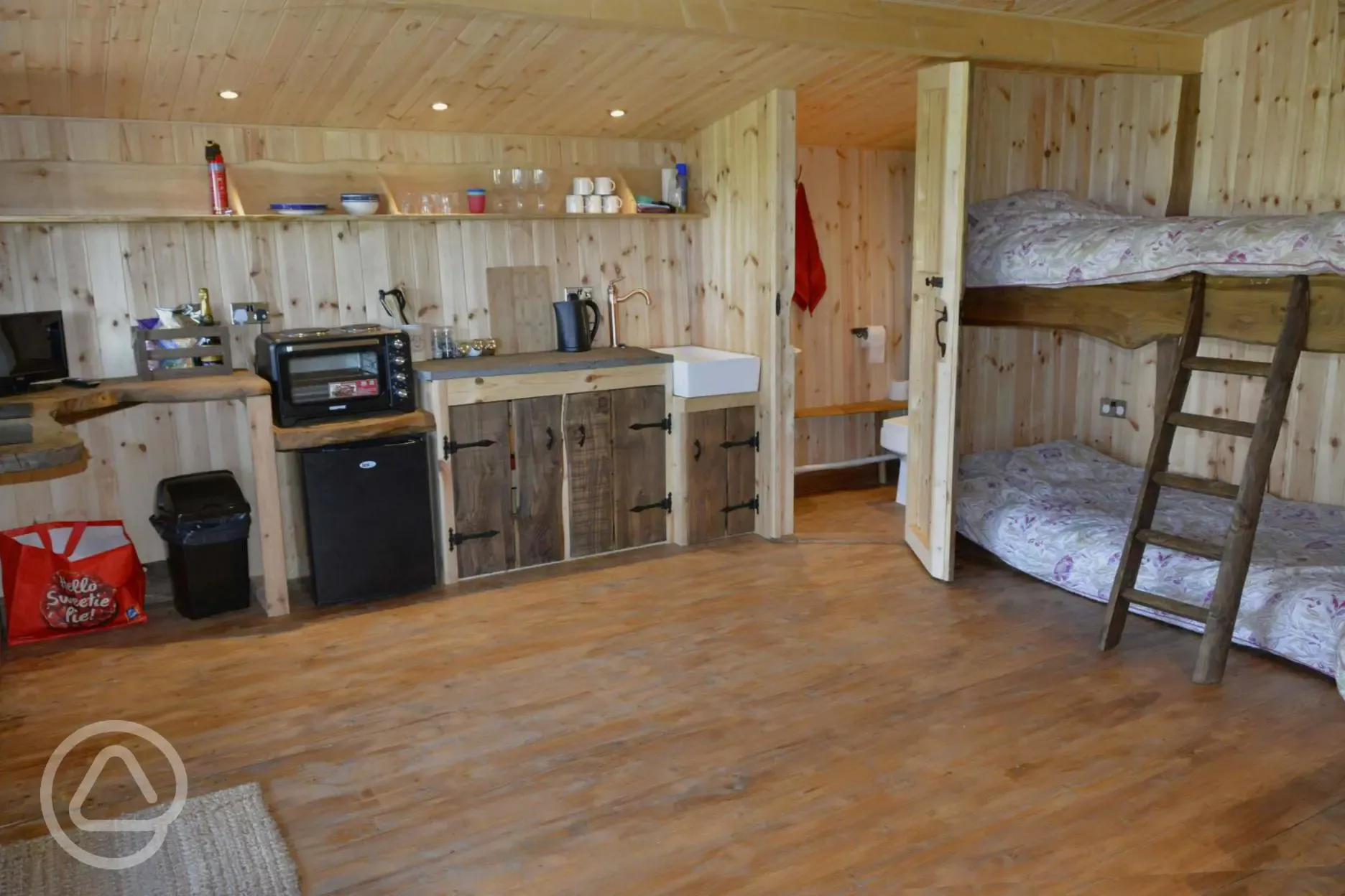 Caradoc Lodge with a kitchen including gas hob and fridge 