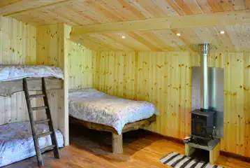 Caradoc Lodge with a double bed and bunk bed