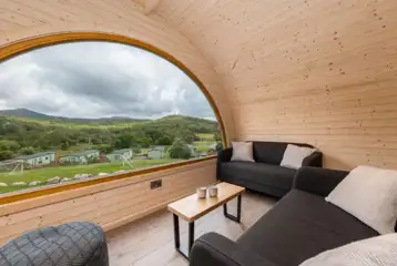 Parkgate cabin living area with sofas and countryside views
