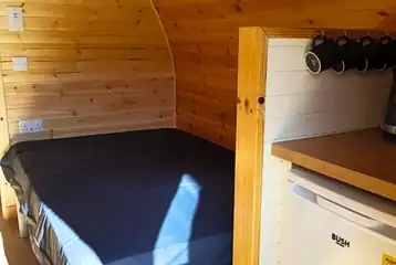 Large hiker pod with sofa bed interior with fridge, mugs, kettle and microwave Large hiker pod with sofa bed interior with fridge, mugs, kettle and microwave